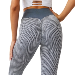 Woman wearing high waist grid tights during a workout session