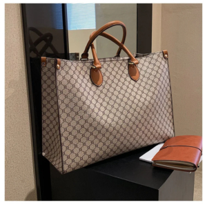 Front view of a vintage monogram retro shoulder bag in faux leather