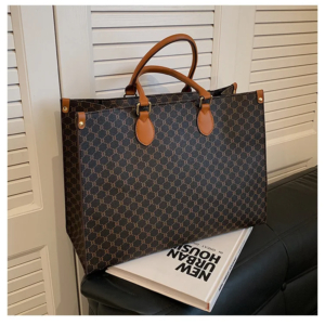 Front view of a vintage monogram retro shoulder bag in faux leather