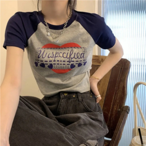 Model wearing a vintage graphic print y2k crop top styled with streetwear jeans