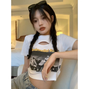 Woman wearing a Y2K style short sleeve hollow out crop top in a street style setting