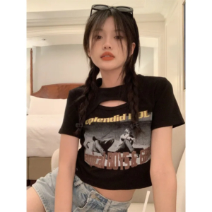 Woman wearing a Y2K style short sleeve hollow out crop top in a street style setting