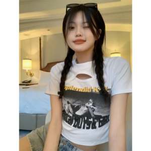 Woman wearing a Y2K style short sleeve hollow out crop top in a street style setting