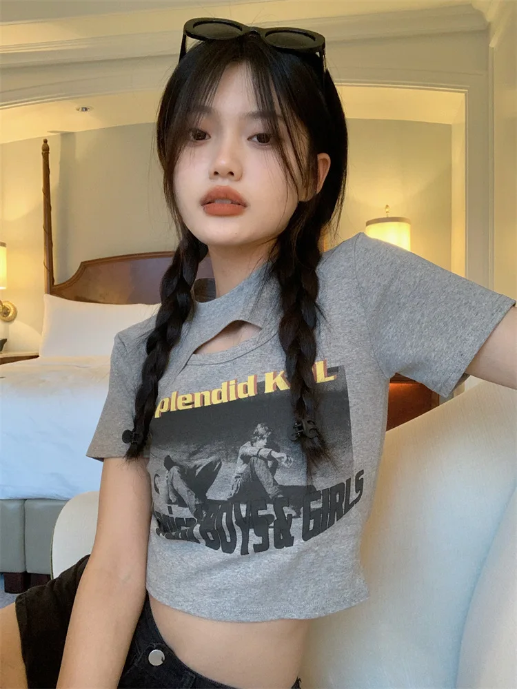 Woman wearing a Y2K style short sleeve hollow out crop top in a street style setting
