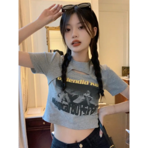 Woman wearing a Y2K style short sleeve hollow out crop top in a street style setting
