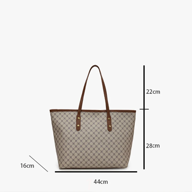 Model wearing a sleek minimalist pu leather tote bag carried over the shoulder in a city setting