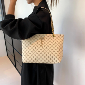 Monogram print soft leather tote bag with hanging charm accessory